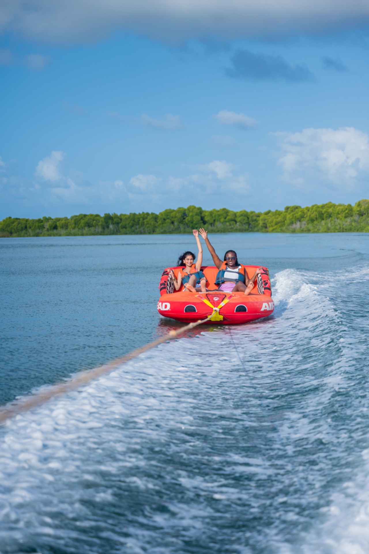 Tubing off the beach — one of Lamu's most exhilarating water activities.